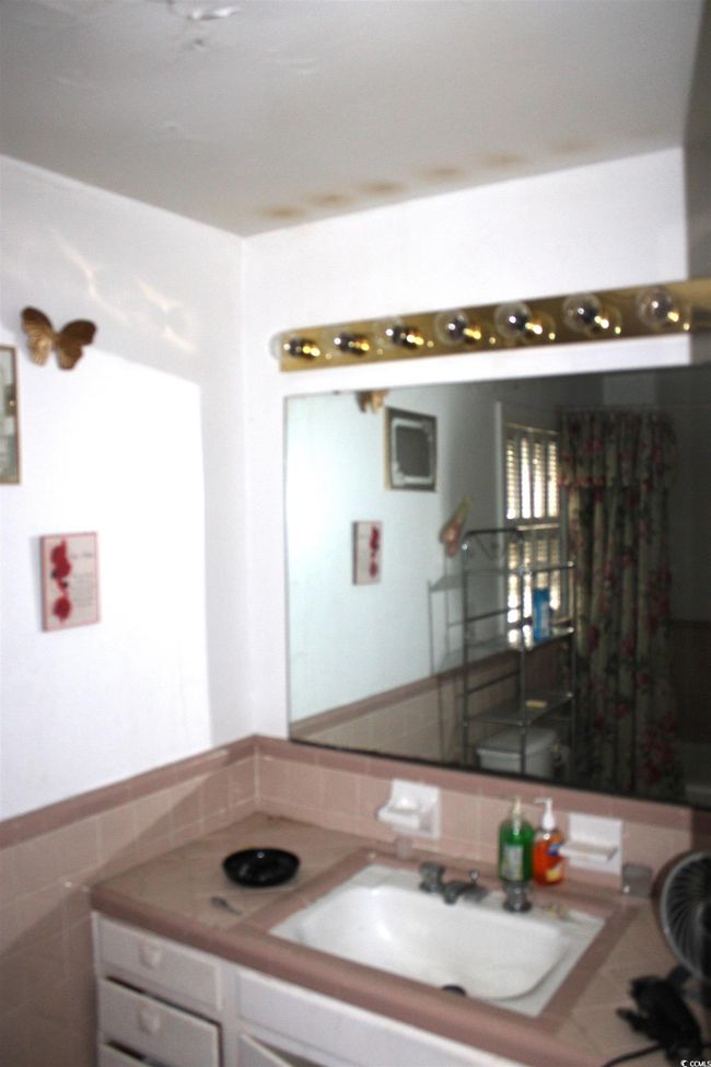 Bathroom with vanity and tile walls | Image 20