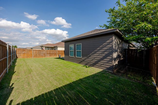 View of fenced backyard | Image 28