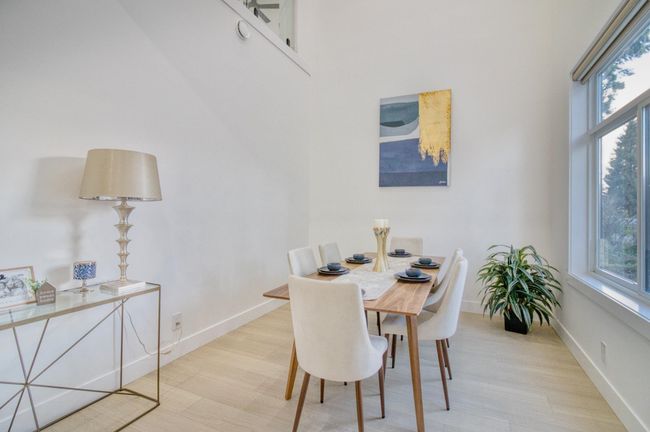 Dining space featuring baseboards and light wood-type flooring | Image 5