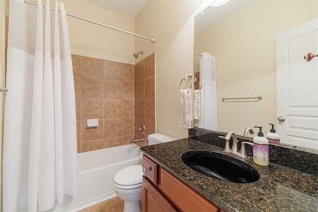 Full bath located across from the guest room. | Image 9