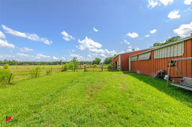 Rear view of horse barn looking over pasture | Image 7