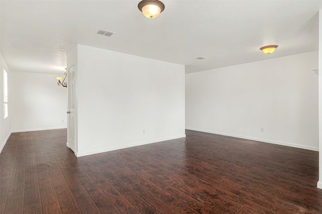 Empty room featuring dark wood finished floors and baseboards | Image 19
