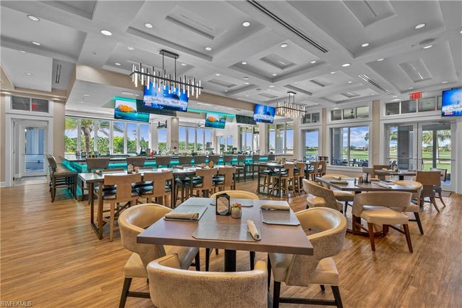 Dining space featuring beam ceiling, light hardwood / wood-style flooring, and coffered ceiling | Image 21