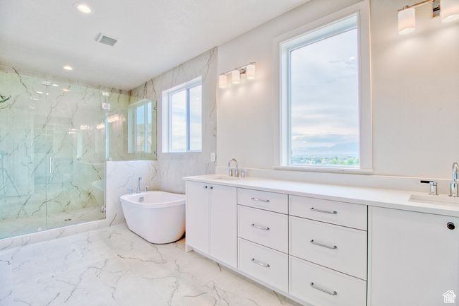 The primary bath is amazing!! double sinks, large tub, and massive separate shower. | Image 10