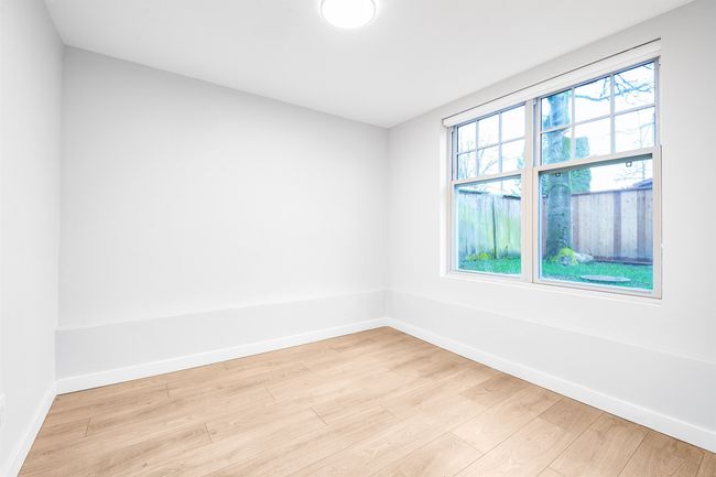 Empty room with light wood finished floors and baseboards | Image 11