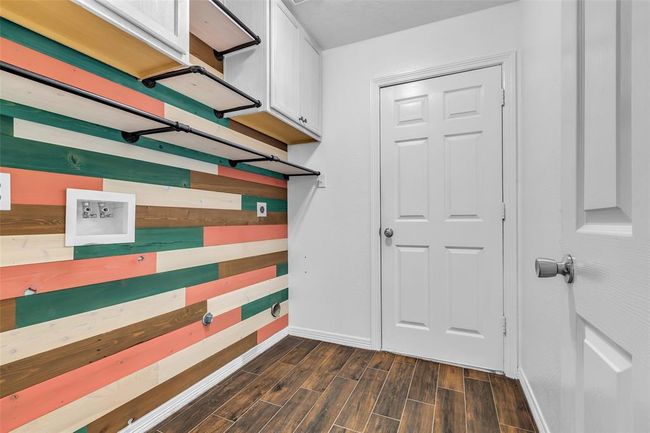 Utility room with custom accent wall. | Image 33