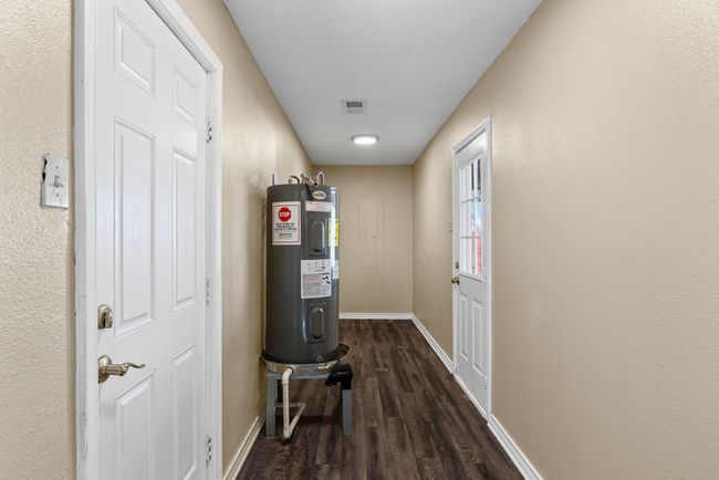 Backyard entry, carport entry. water heater and W/D connections | Image 16
