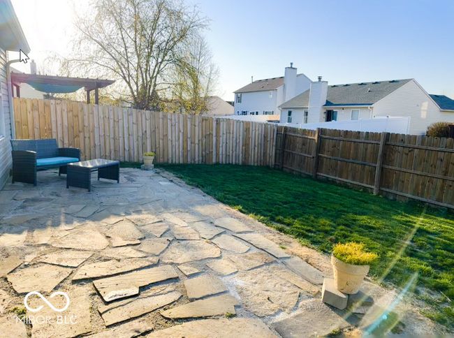 view of patio / terrace featuring a fenced backyard and a residential view | Image 4