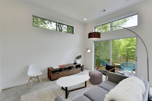 Living area featuring recessed lighting, plenty of natural light, visible vents, and baseboards | Image 5