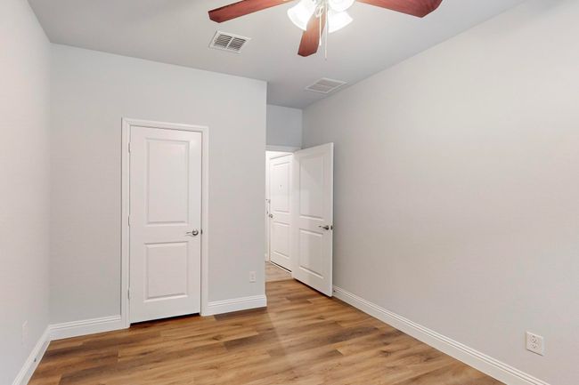 Unfurnished bedroom featuring ceiling fan and light wood-type flooring | Image 22
