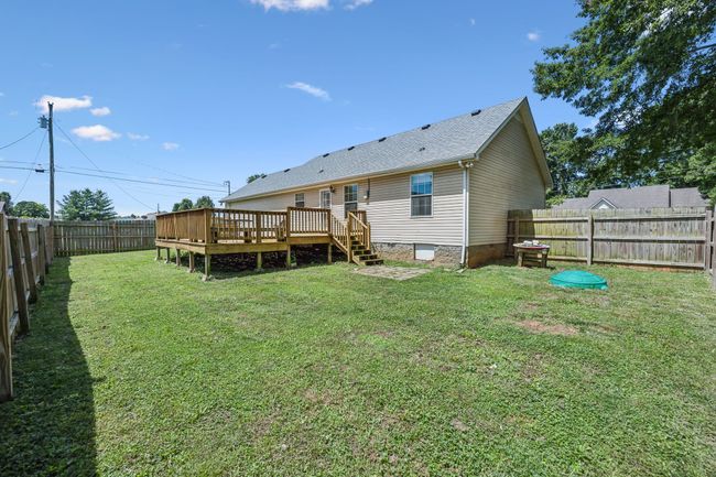 The large backyard is enclosed by a secure, privacy fence for pets and little ones to safely enjoy outdoor playtime! 2095 Bolden Drive, Murfreesboro, TN 37127 | Image 24