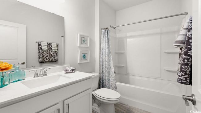 Bathroom with vanity, shower / tub combo with curtain, and toilet | Image 26