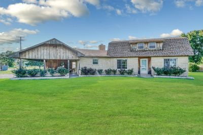 View of front of home with a front yard, 503 N Sheb Wooley Ave, Erick, OK 73645. | Image 1