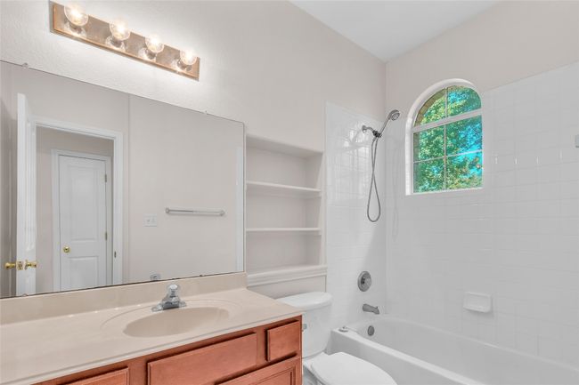 Bathroom featuring shower / washtub combination and vanity | Image 22