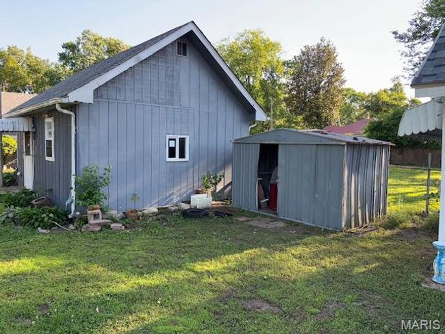 Rear view of property with a shingled roof | Image 15