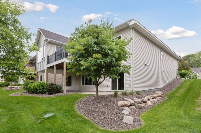 Fully landscaped front and back...Enjoy maintenance free living as the association takes care of lawn, snow and sanitation | Image 44