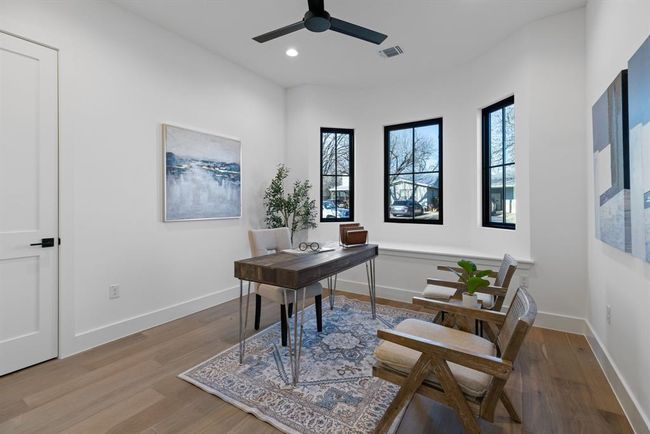 Office area featuring wood finished floors, recessed lighting, a ceiling fan, and baseboards | Image 4