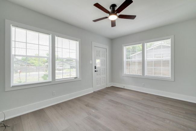 Entryway featuring a ceiling fan and light wood-style floors | Image 9