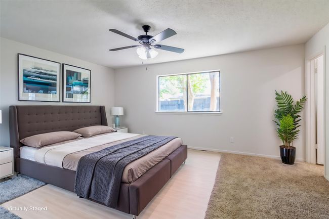 Bedroom with ceiling fan and baseboards | Image 13