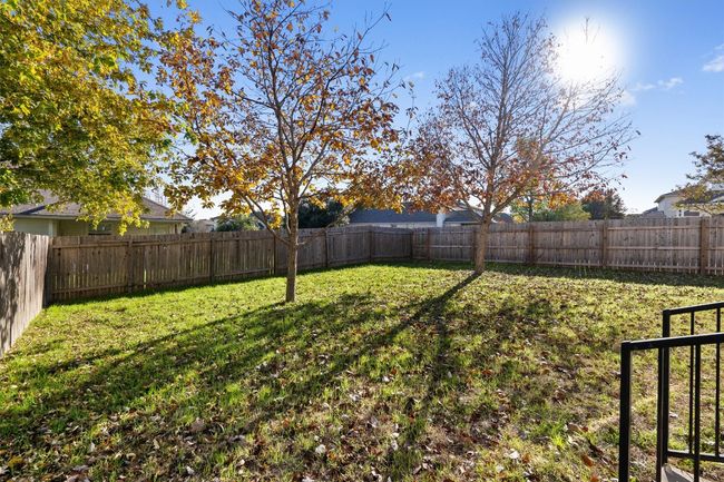 View of fenced backyard | Image 32