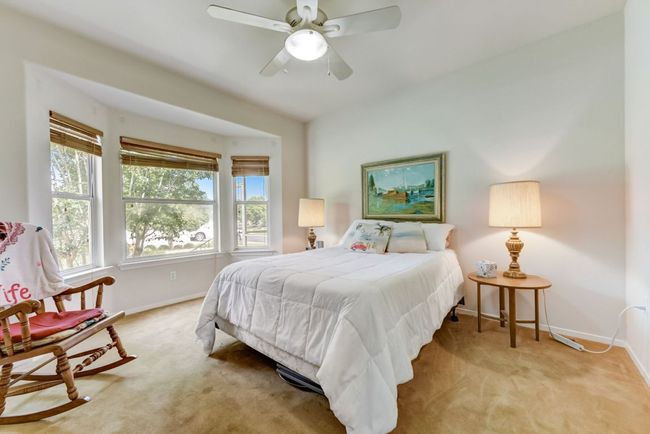 Primary Bedroom: "Wake up to natural light pouring through the bay window in your tranquil primary bedroom. ???? #SereneRetreat #MorningSun" | Image 5