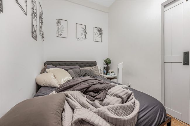 Bedroom featuring light wood finished floors | Image 12