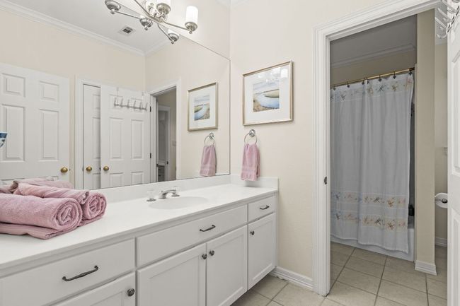 Jack-N-Jill Bathroom and opens to hall leading to the upstairs living area. | Image 23