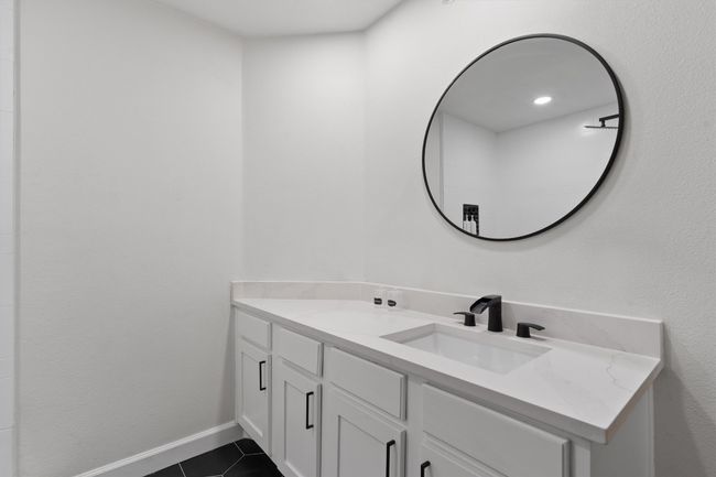 Bathroom featuring vanity, tile patterned floors, and baseboards | Image 16
