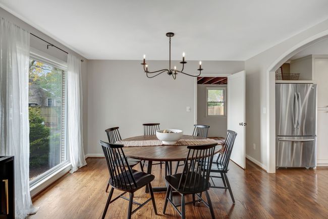 Just off the Dining area leads you into flex space w Full Bath plus Laundry and Drop Zone | Image 10