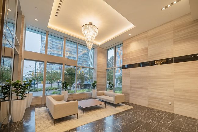 Community lobby with a high ceiling and floor to ceiling windows | Image 21