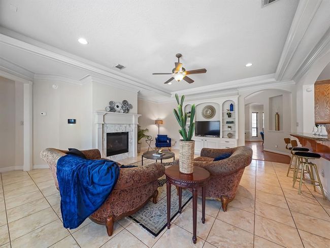 Cozy living room bathed in natural light. | Image 16