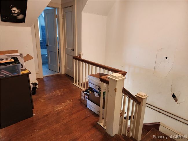 Upstairs landing with 2 rooms and full bath. | Image 25