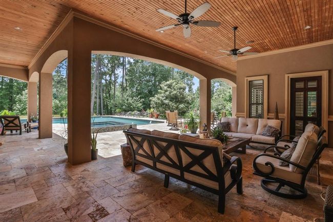 There is over 2, 000 square feet of travertine patio decking outside. Spread your wings and chill while you grill in the outdoor kitchen... | Image 44