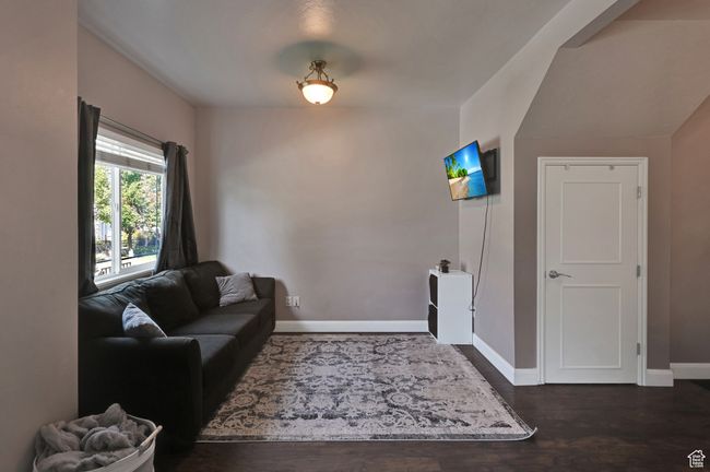 Living room with dark hardwood / wood-style flooring | Image 13