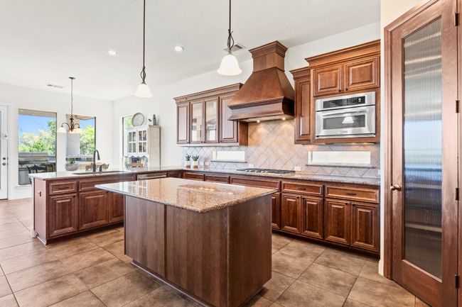 Dine at the counter height seating, the breakfast nook or in the formal dining room for more upscale occasions. | Image 10