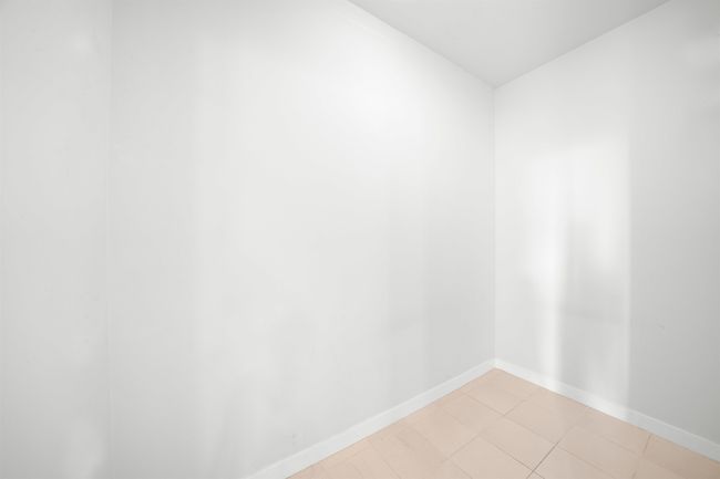 Unfurnished room featuring baseboards | Image 9