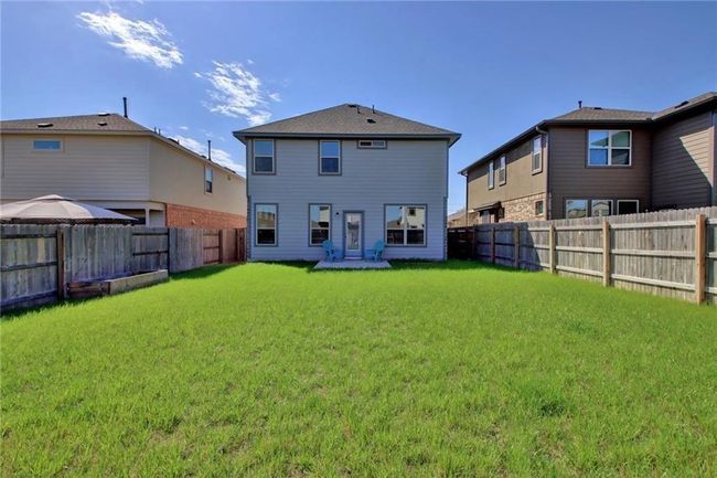 Back of house with a fenced backyard | Image 35