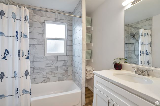 Full bath with shower / bathtub combination with curtain and vanity | Image 8