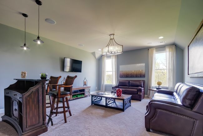 The spacious bonus room over looks the back yard. | Image 51