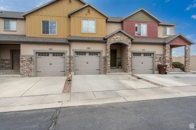 View of front facade featuring a garage | Image 1