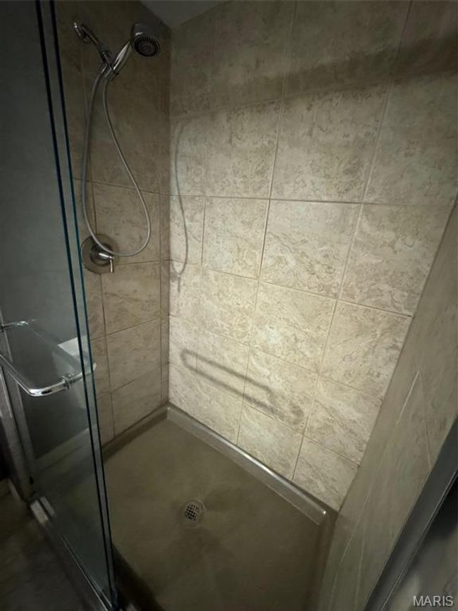 primary bathroom with an enclosed shower | Image 24