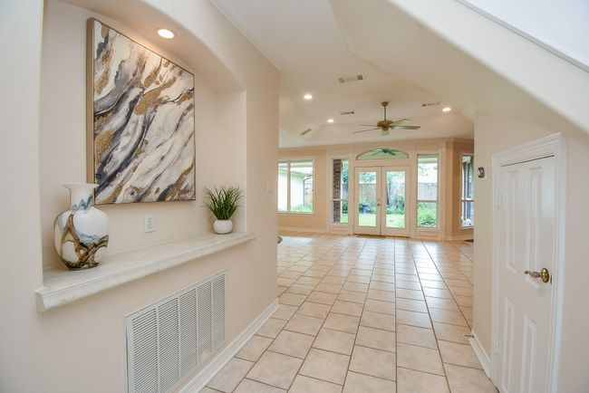 Inviting entryway with a stylish art niche, perfect for showcasing your favorite pieces. | Image 8