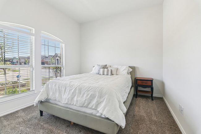 Carpeted bedroom with baseboards | Image 27