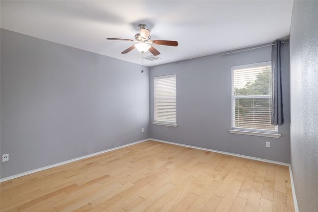 Huge primary bedroom with hardwood floors | Image 14
