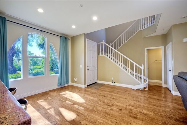 Exceptional setting, sunlit and ready for your own personal touches, dining area or a intimate sitting room, living room is just to right in this photo | Image 12
