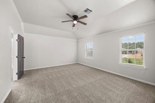 Spacious Primary Bedroom with Raised Ceilings | Image 21