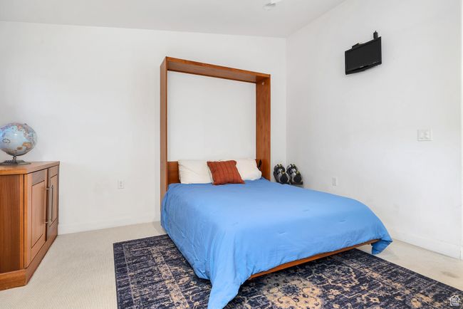 Bedroom featuring baseboards and light colored carpet | Image 29