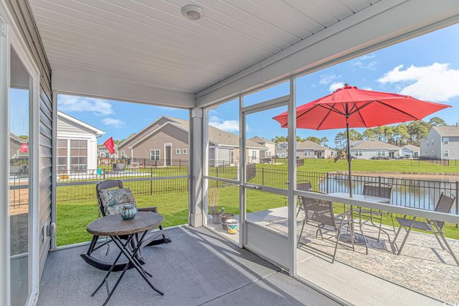 Sunroom / solarium with a water view | Image 19