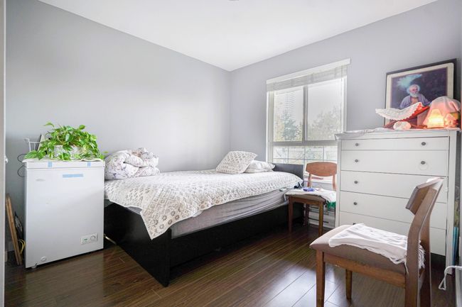 Bedroom featuring hardwood / wood-style flooring | Image 5