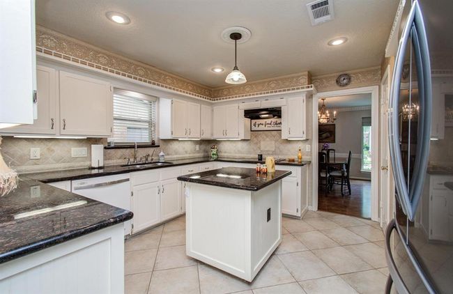 An amazing kitchen with SO MUCH countertop space and storage! | Image 12